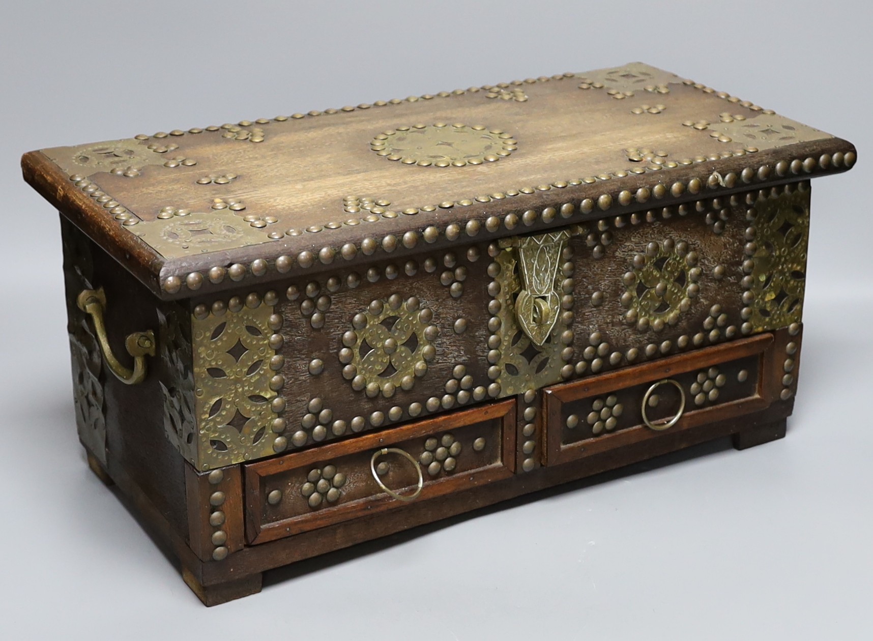 An Indian brass studded and mounted box, 45cms wide x 21cms high